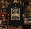 My Financial Advisor Hated This Purchase graphic tee in a vintage garage workshop by Nine Sixteen Supply Co.