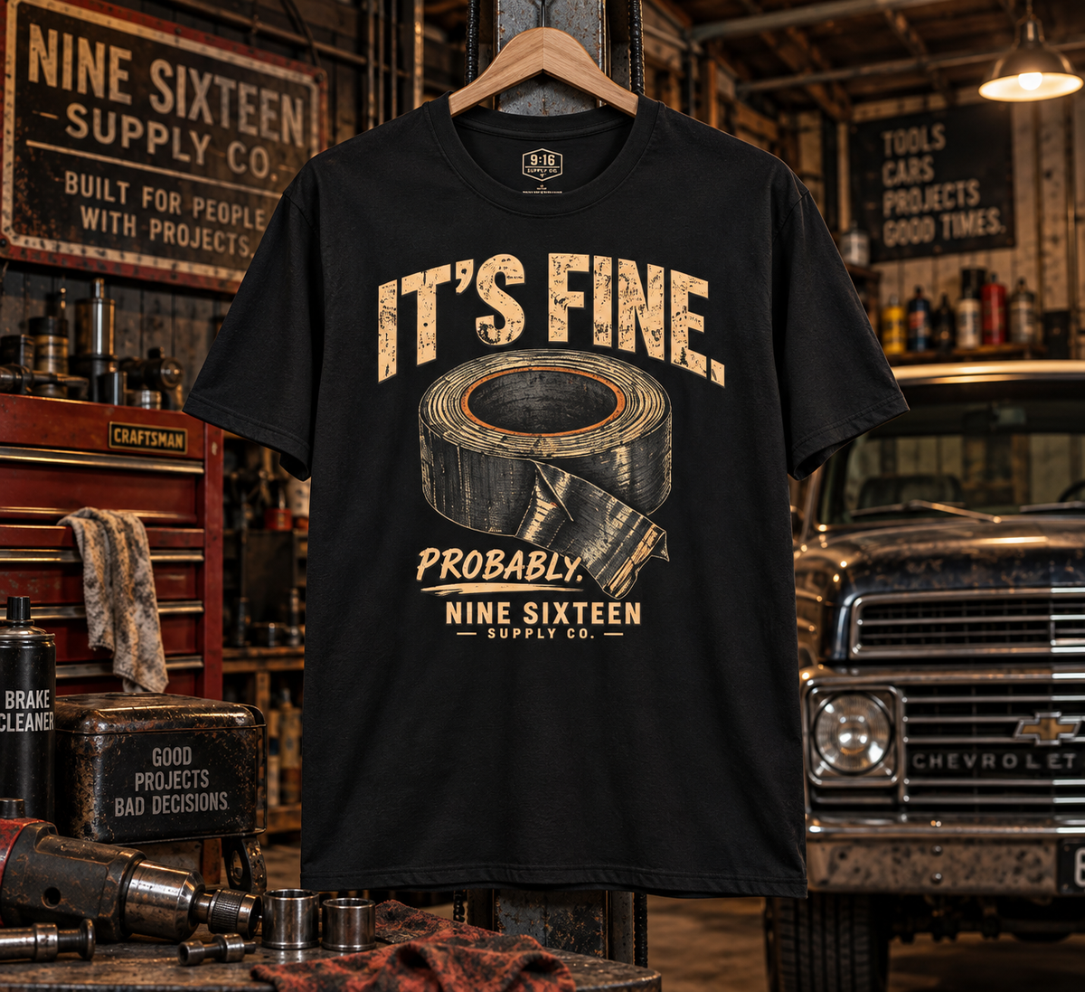 It's Fine. Probably. graphic tee in a vintage garage workshop by Nine Sixteen Supply Co.